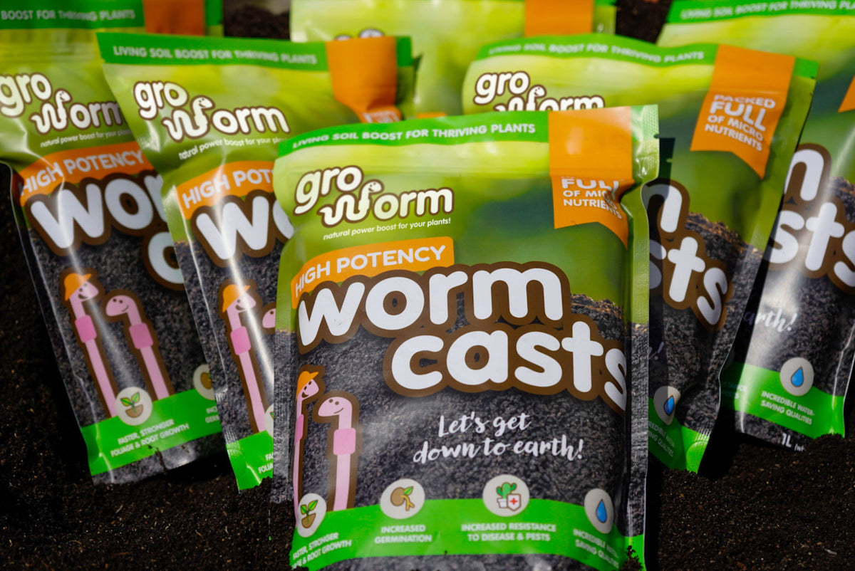 A display of Gro Worm worm cast product pouches in various sizes on a shelf